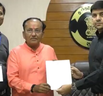 BJP candidate from Surat Lok Sabha seat Mukesh Dalal receives his victory certificate after being elected unopposed.