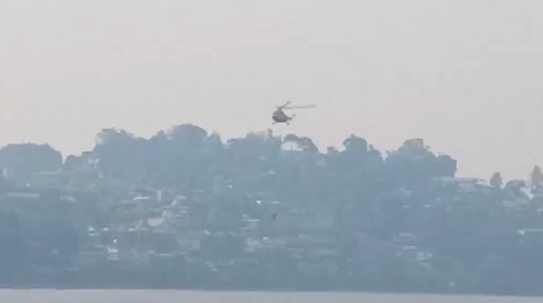 IAF sprinkled water from MI-17 helicopter to extinguish forest fire in Nainital, Uttarakhand