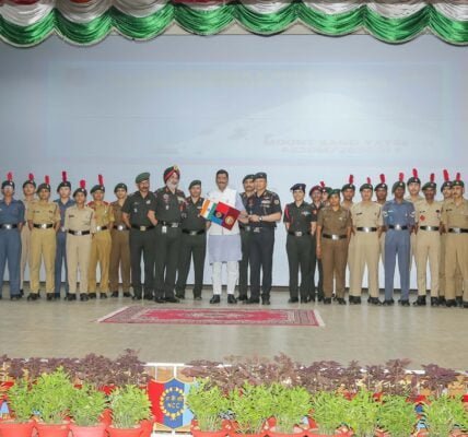 Minister of State for Defence Sanjay Seth welcomes the team of NCC Girl and Boy Cadets with flag after their successful expedition to Mount Kang Yatse-II