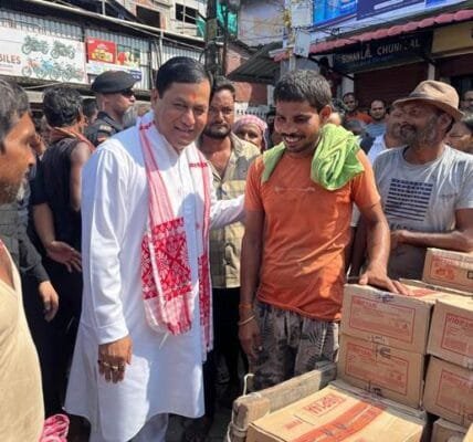 Union Minister for Ports, Shipping and Waterways Sarbananda Sonowal meets rickshaw and cart pullers in Dibrugarh