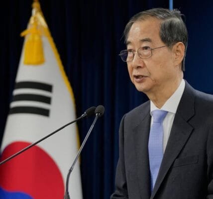 South Korea's Constitutional Court reinstates impeached Prime Minister Han Duk-soo as acting president