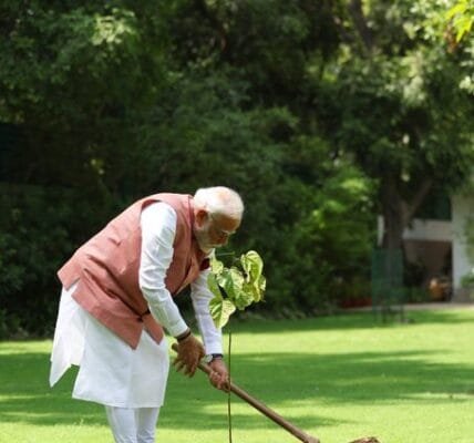 PM Modi plants a vermilion tree at his residence in New Delhi on the occasion of World Environment Day