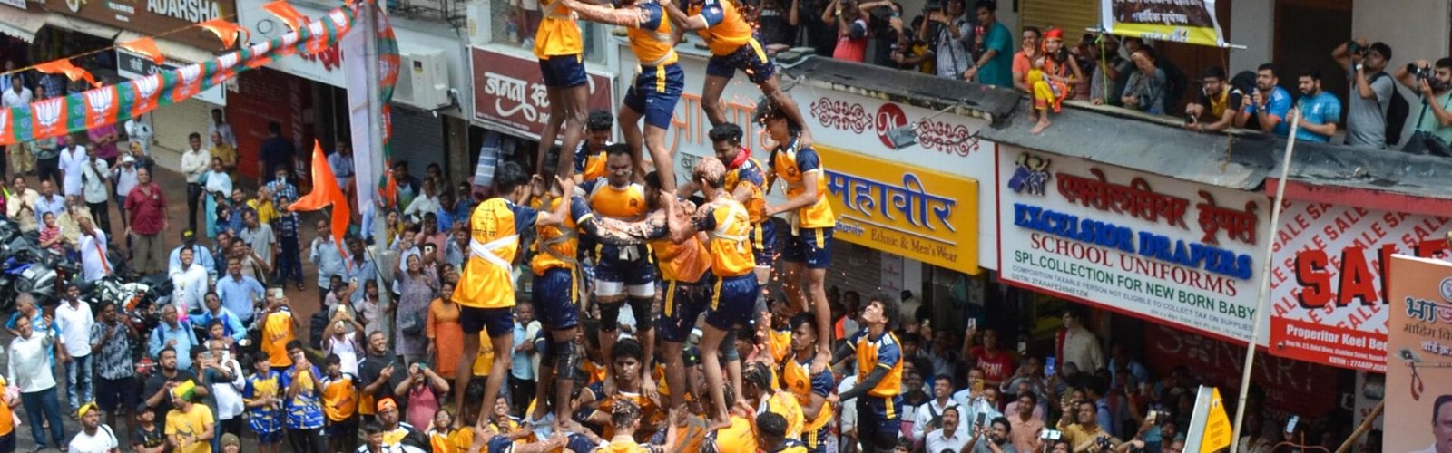 Govindas participating in Dahi Handi festival