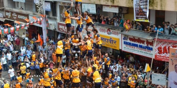 Govindas participating in Dahi Handi festival