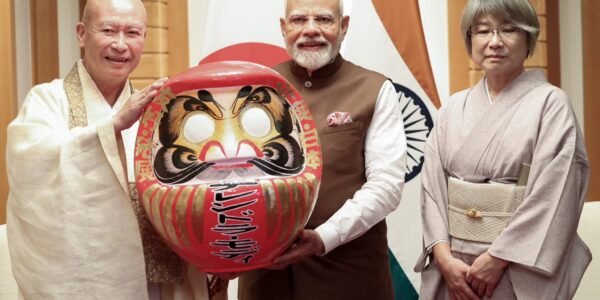 PM Modi was presented a Daruma doll by Seishi Hirose, Chief Priest of Shorinzan Daruma-ji Temple