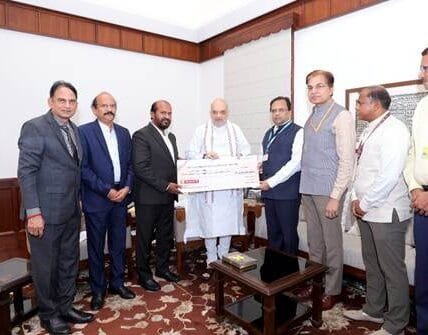 Repco Bank handed over dividend cheque of Rs 22.90 crore for the year 2024-25 to Union Home Minister Amit Shah