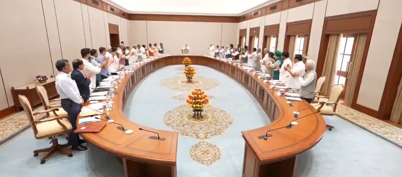 Cabinet members gave Prime Minister Modi a standing welcome.